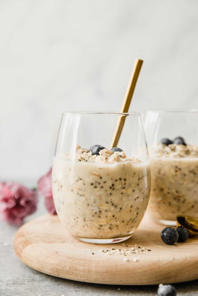 Containers of prepped high-protein breakfast ingredients organized in a refrigerator.