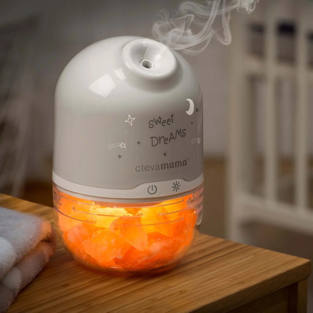 Clevamama salt lamp emitting a soft, warm amber light suitable for a nursery.