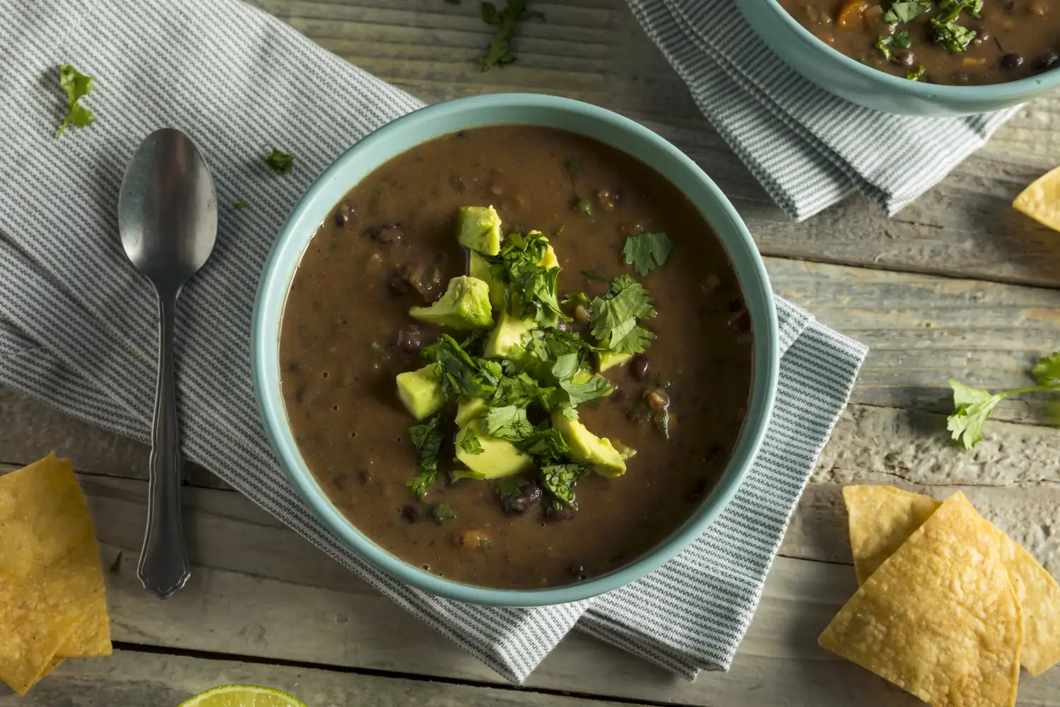Black bean soup with avocado and cilantro.