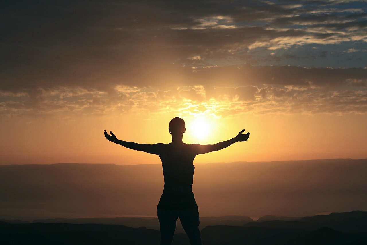 A person feeling vibrant and full of energy outdoors in morning light
