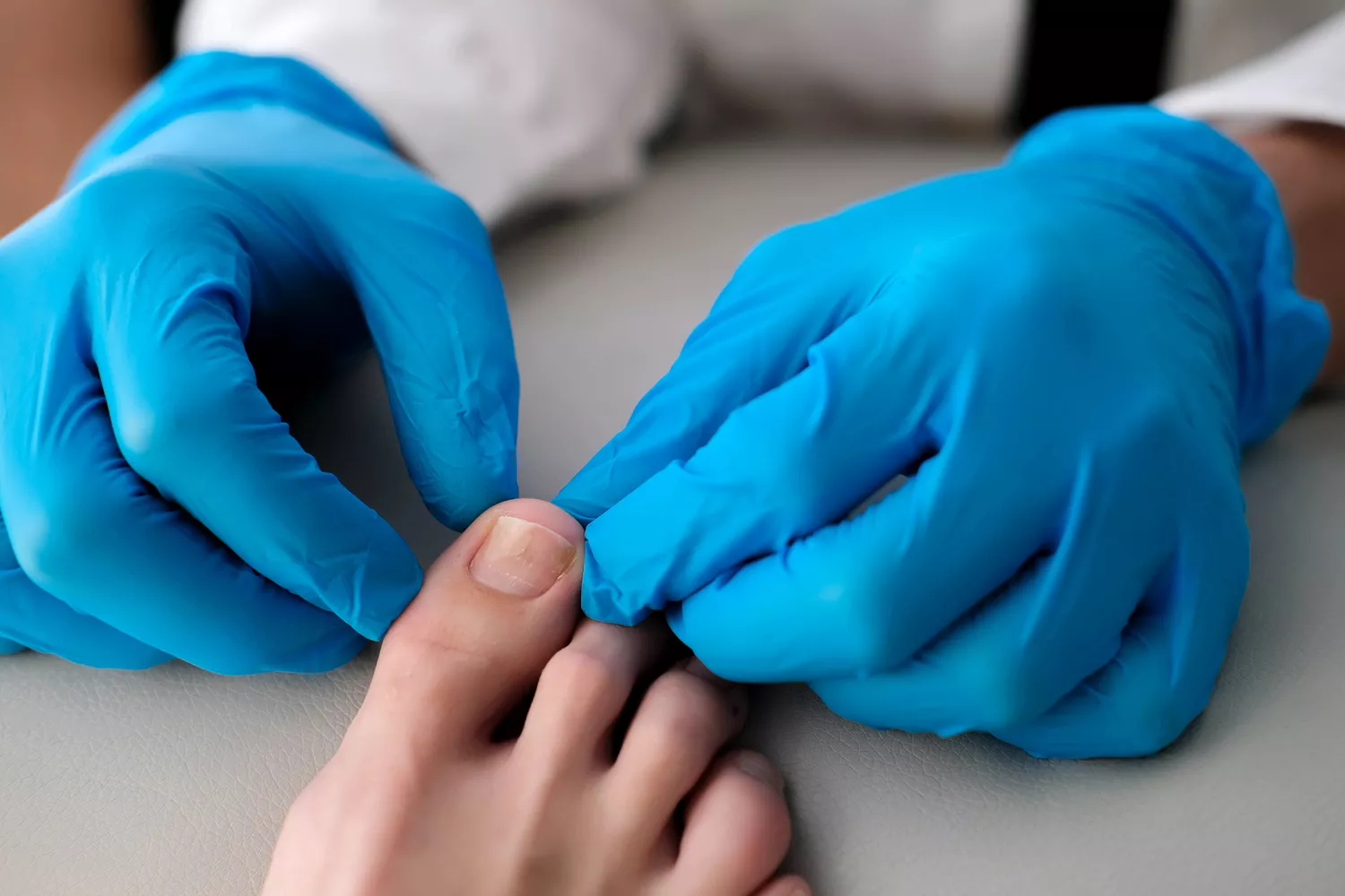 A doctor examining a patient in a clinical setting to assess symptoms of Post-acute sequelae of SARS-CoV-2.
