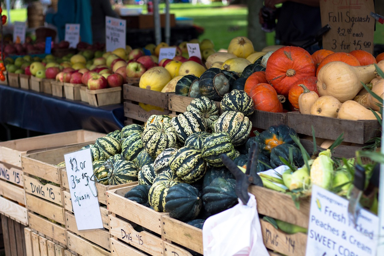 A colorful outdoor farmers market stall with fresh organic produce