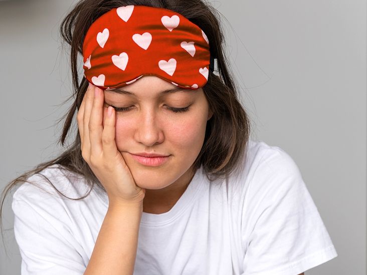 Top-down view of a 3D molded sleep mask showing deep eye cavities and contoured edges.