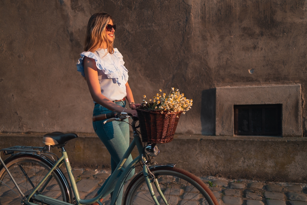 A person enjoying a bicycle ride in the sunshine.