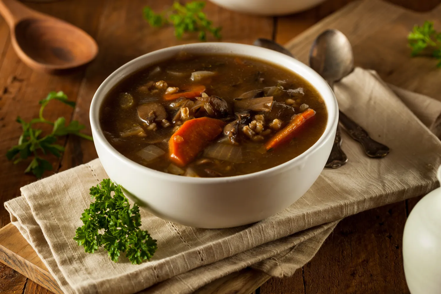 A bowl of mushroom barley soup.