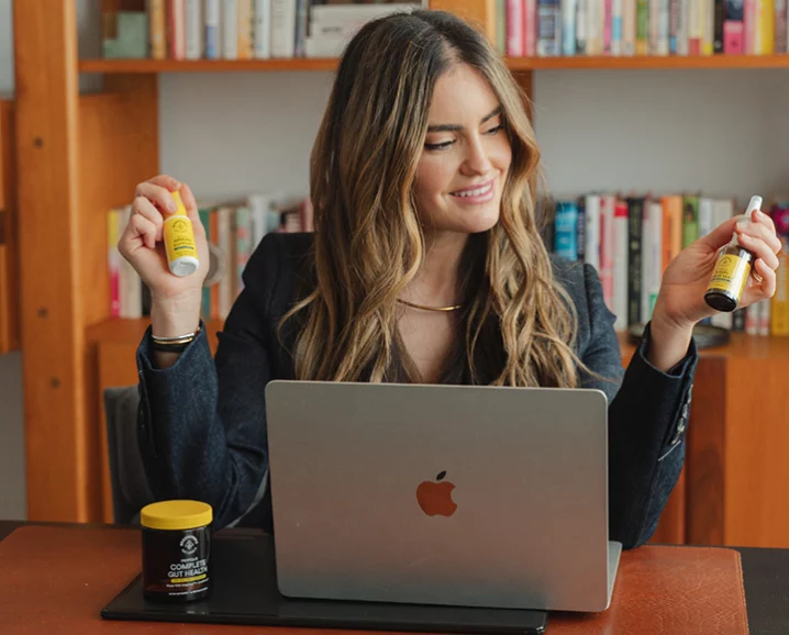 A jar of B.Powered Superfood Honey showing the rich, thick texture of royal jelly and propolis blends.