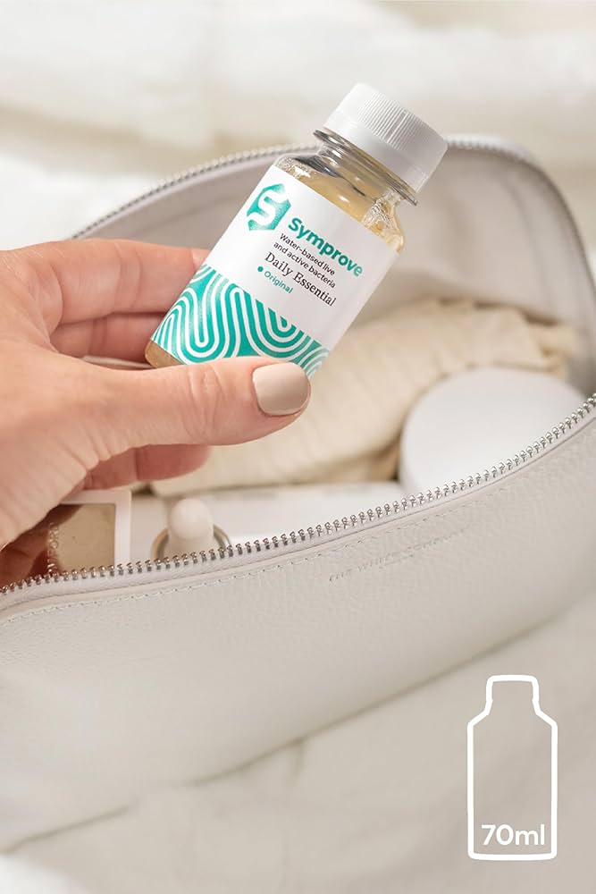 Close-up of Vitamin C and elderberry supplement packaging with a blurry airport terminal in the background.