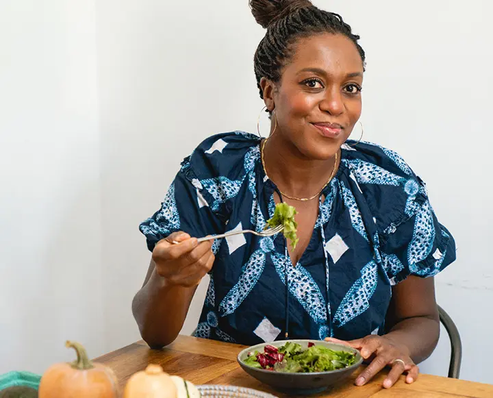 A balanced meal plate featuring a variety of textures including seeds, vegetables, and protein sources.