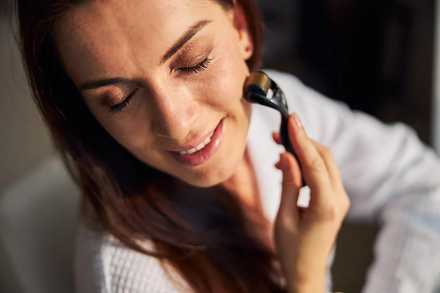 A person using a professional-grade health tool as part of a nightly maintenance routine.