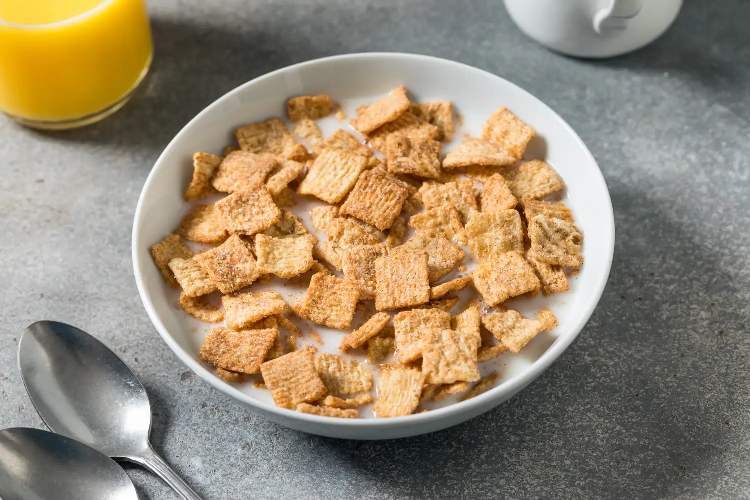 A bowl of fortified cereal with milk representing nutritional wellness.