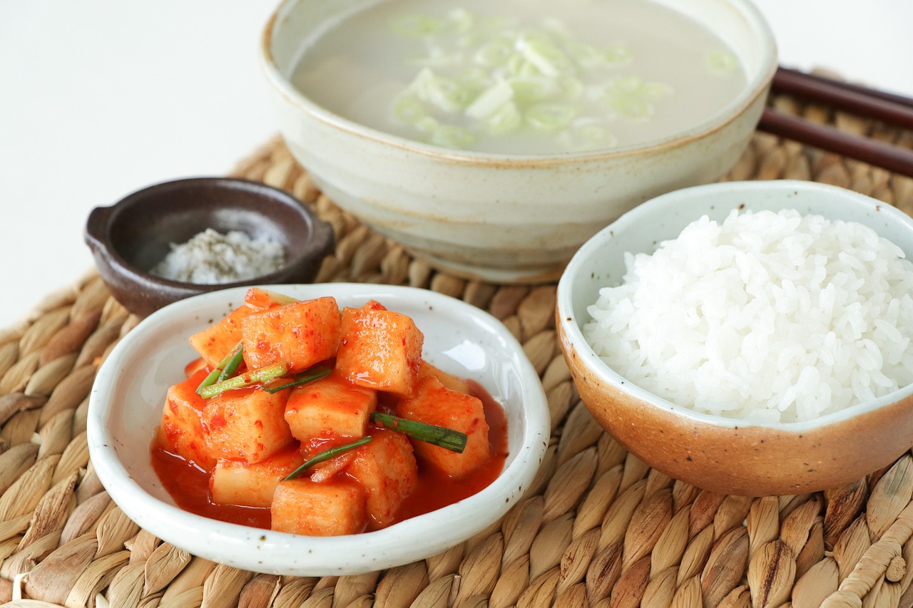 Assortment of fermented foods like kimchi and yogurt in jars
