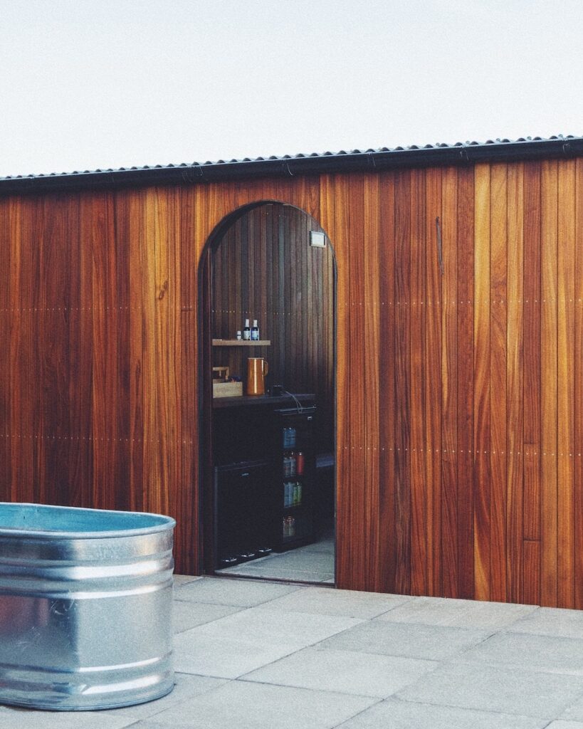 Outdoor rooftop saunas in Brixton with an urban backdrop.