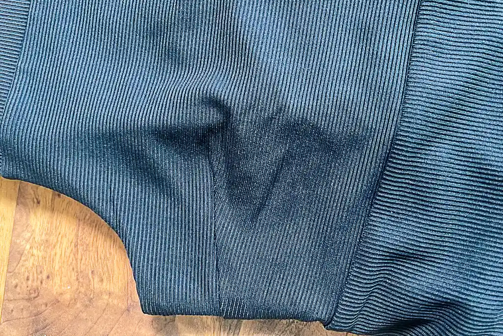 Close-up of the technical performance fabric on a Girlfriend Collective dress.