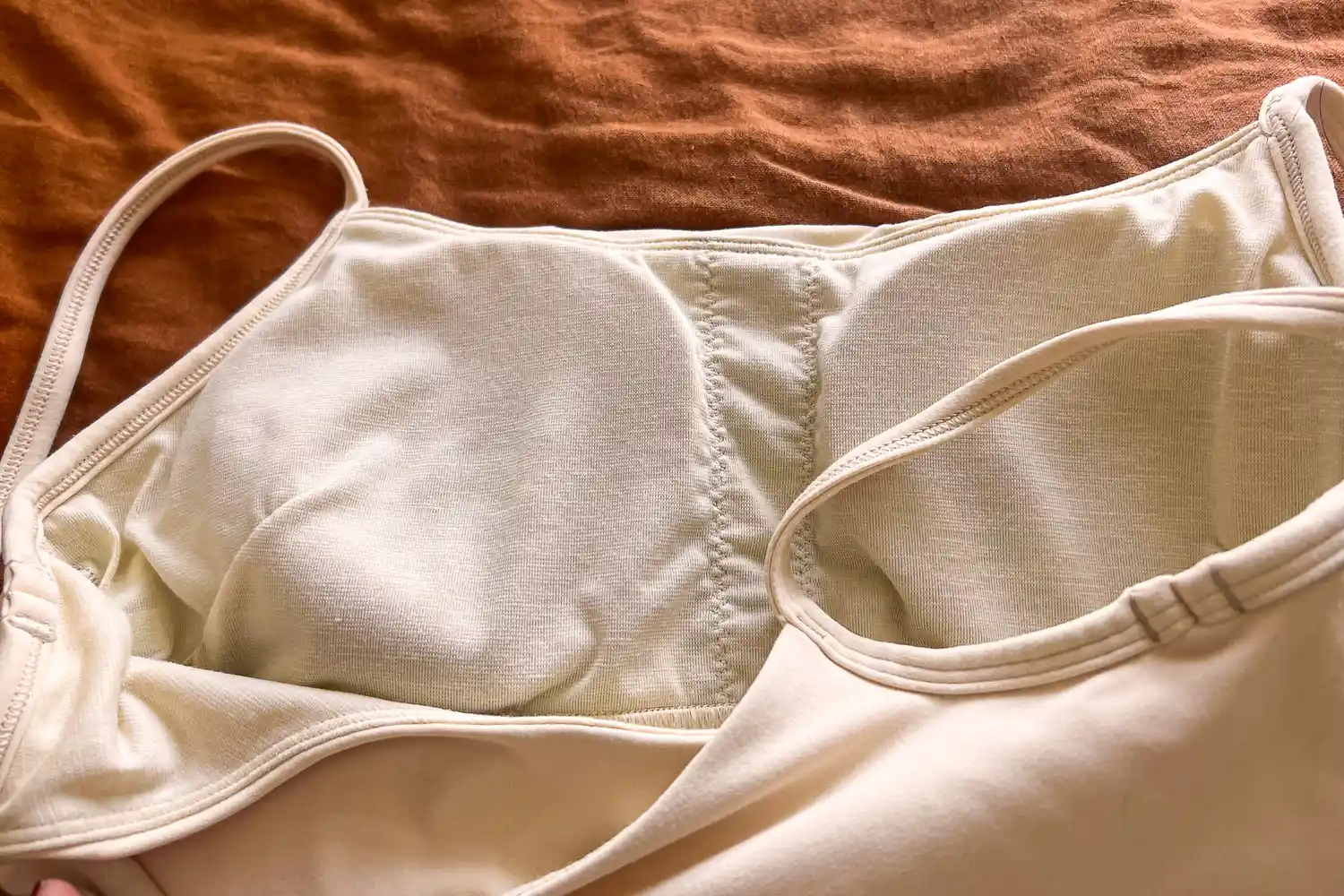 Close-up of the interior lining and removable cups of a sports bra.