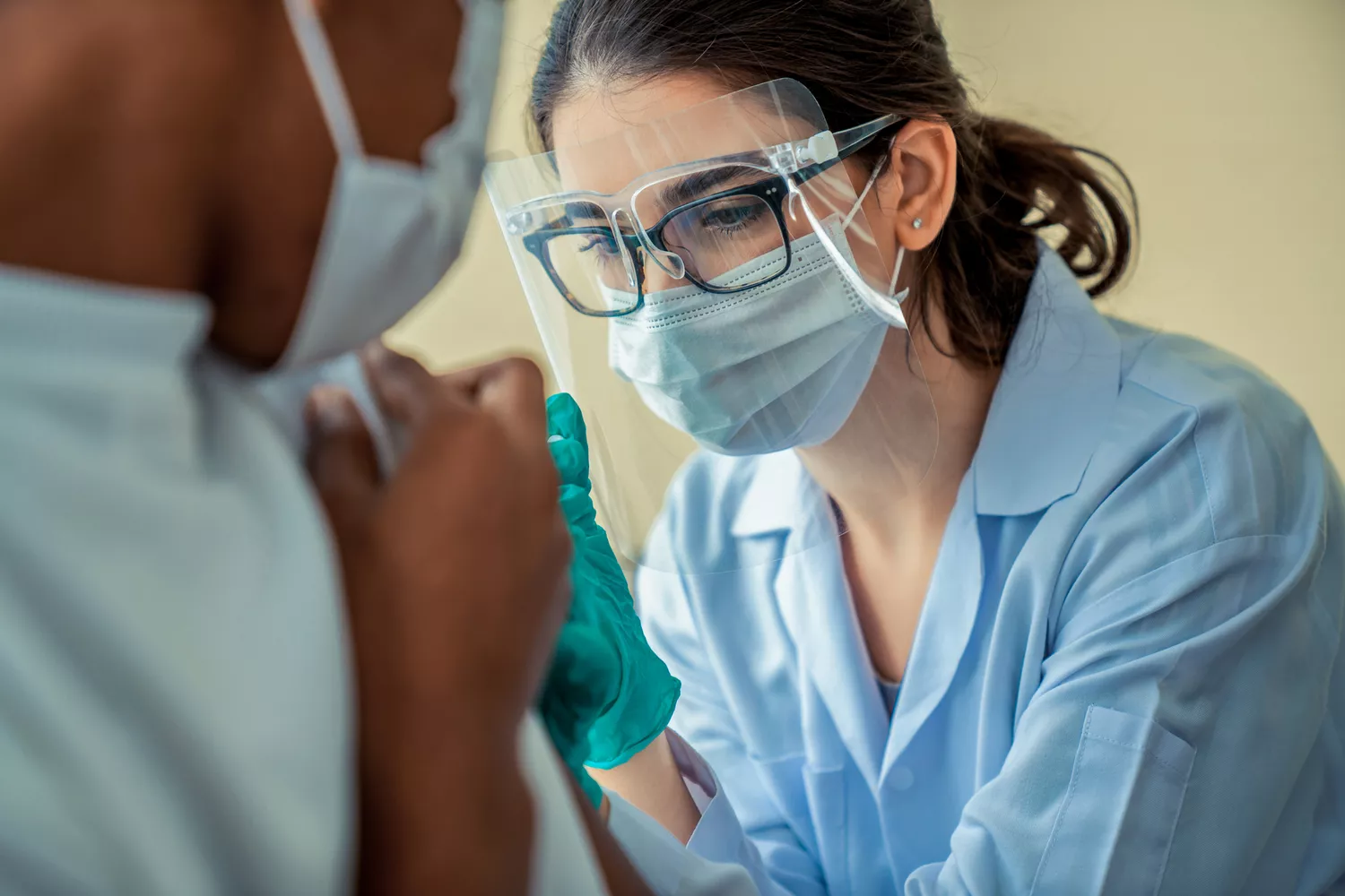 An elderly patient with MS receiving medical care in a clinical setting.